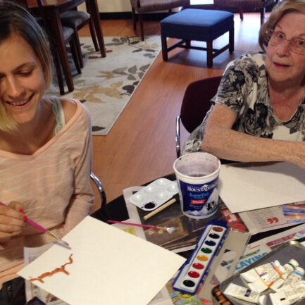 Alyssa teaches guest Loretta about watercolors